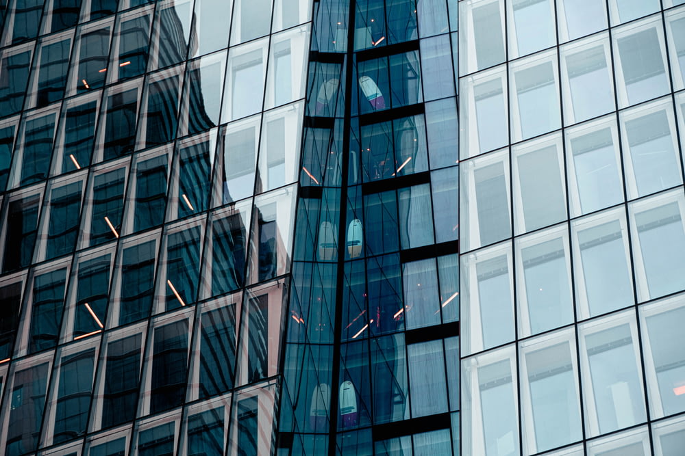 blue and brown glass walled high rise building.jpg