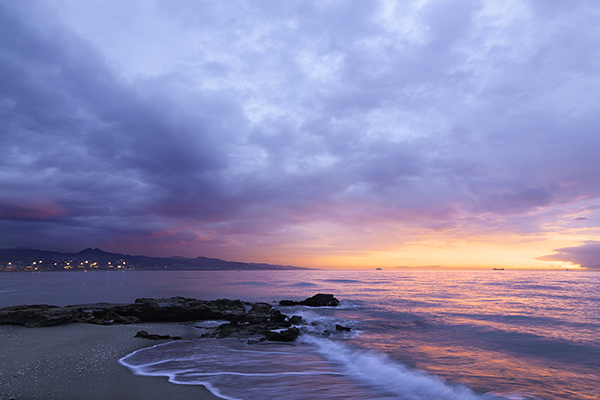 waves of body of water splashing on sand.jpg